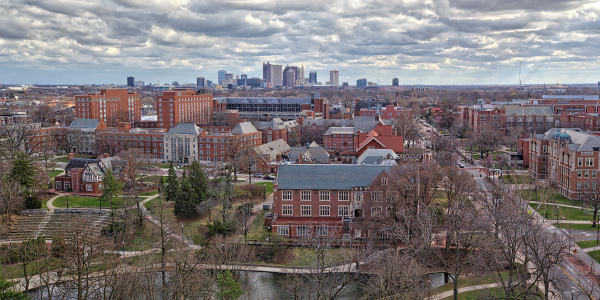 Photograph of the Ohio State campus with the Columbus skyline in the background