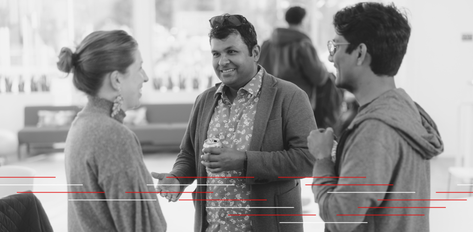 Professor connecting with students and staff